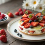 Image of an Easy Fruit Suedoise recipe, a simple layered dessert. Featuring a base of fresh seasonal fruits, a smooth custard layer, and a crispy topping, ready to enjoy
