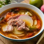 Sinigang is a beloved Filipino soup known for its distinct sour and savory flavor.